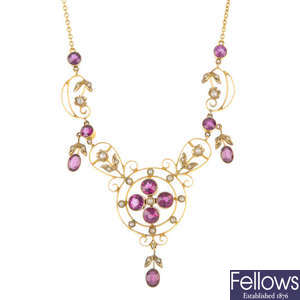 An early 20th century 9ct gold garnet and split pearl necklace.