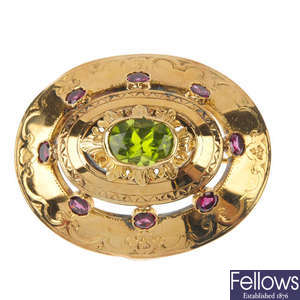An early 20th century continental gold peridot and garnet brooch.