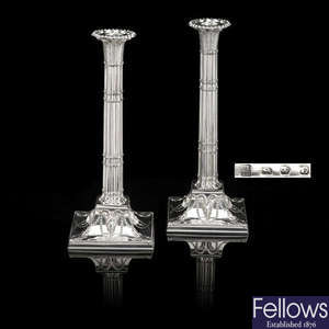 A George III pair of silver cluster column candlesticks with ram's head masks.