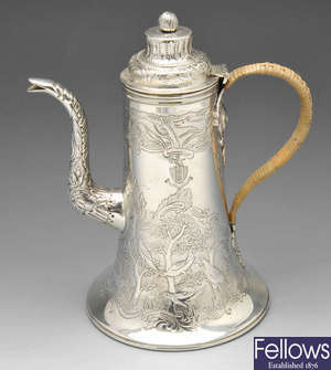 Edwardian silver coffee pot with animal engraving.