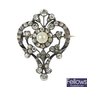 An early 20th century silver paste and imitation pearl brooch.