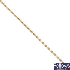 A 9ct gold diamond line necklace.