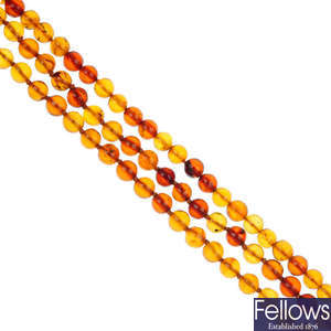 A three row amber bead necklace.
