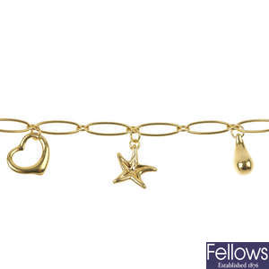 TIFFANY & CO. - an 18ct gold charm bracelet, by Elsa Peretti for Tiffany & Co.