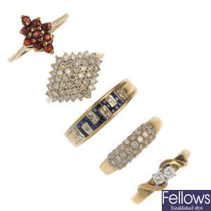 A selection of five 9ct gold gem-set rings.