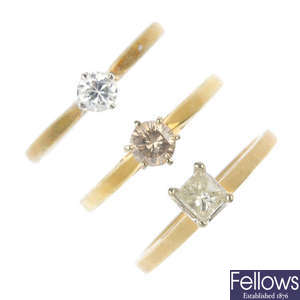 A selection of six diamond and gem-set single-stone rings.