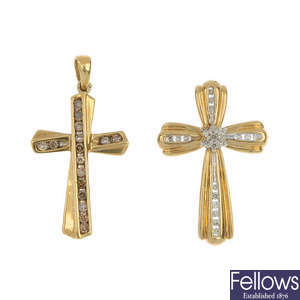 Two cross pendants and a pair of ear studs.