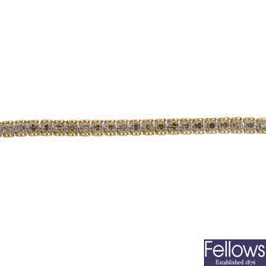 A 9ct gold diamond line bracelet.