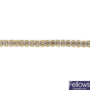 A 9ct gold diamond bracelet.
