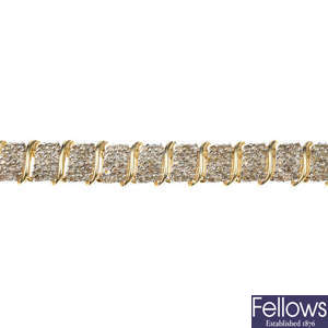 A 14ct gold diamond bracelet.
