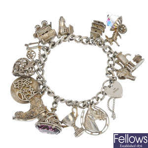 Two charm bracelets and five loose charms.