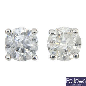 A pair of 9ct gold brilliant-cut diamond and laser-drilled diamond single-stone ear studs.