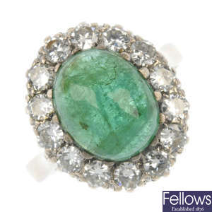 A mid 20th century 18ct gold emerald and diamond cluster ring. 