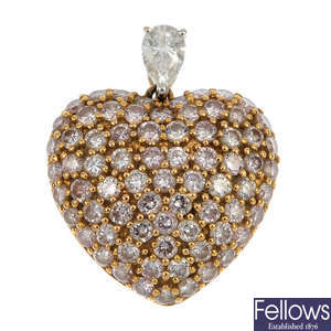 A diamond and colour treated 'pink' diamond heart pendant.