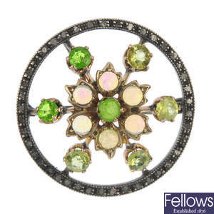 An opal, paste, diamond and green-gem-set brooch.