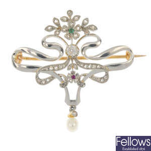 An early 20th century continental gold diamond and gem-set floral brooch.