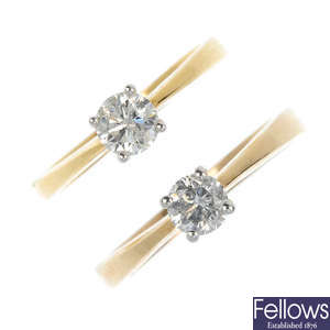 Two gold diamond single-stone rings.