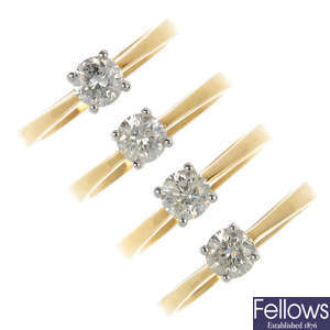 A selection of four 18ct gold diamond single-stone rings. 