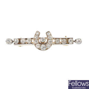 A late 19th century silver and 18ct gold diamond horseshoe brooch.
