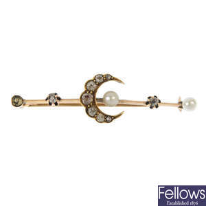 A 15ct gold diamond and seed pearl crescent moon brooch.