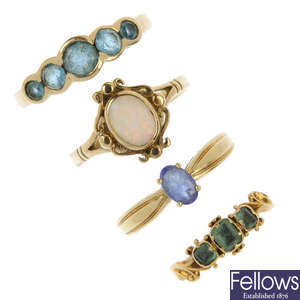A selection of four gem-set rings. 