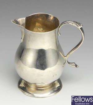 A George II silver cream jug.
