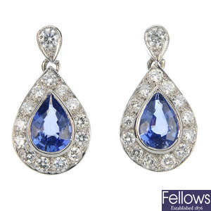 A pair of sapphire and diamond cluster ear pendants.