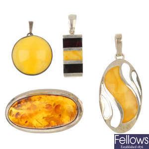 A selection of silver and white metal amber jewellery.