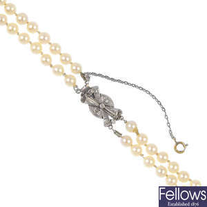 A cultured pearl two-row necklace with diamond-set clasp.