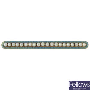 An early 20th century enamel and seed pearl brooch. 