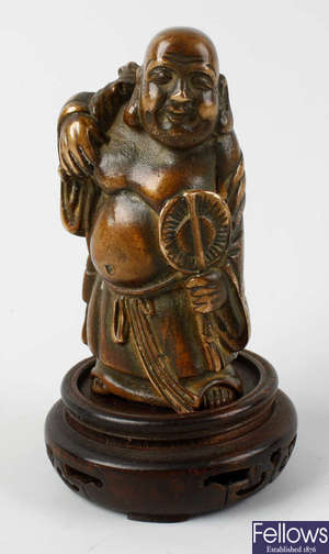A Chinese bronze figure of Budai