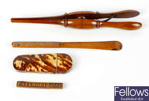 A pair of late 19th century treen glove stretchers, etc. 
