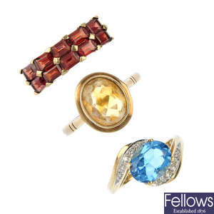 A selection of four 9ct gold gem-set and diamond rings. 