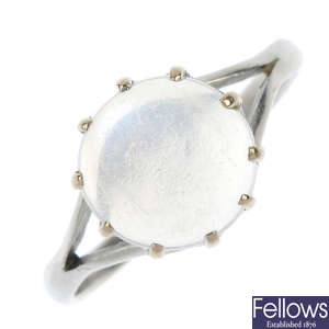 An early 20th century platinum moonstone single-stone ring.