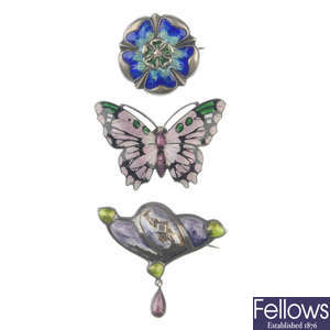 Three enamel brooches, to include a butterfly brooch by J. Aitken & Son.