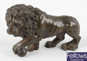 A bronze figure of a lion