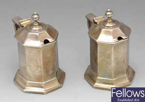 A pair of early twentieth century Britannia silver mustard pots.