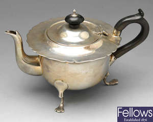 An Edwardian silver teapot & dish.
