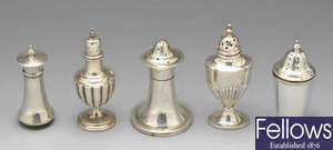 A collection of 13 Victorian and later silver pepperettes.
