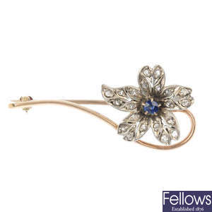 An early 20th century diamond and sapphire floral brooch.