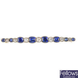 An early 20th century gold sapphire and diamond bar brooch.