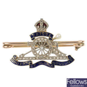 A mid 20th century 18ct gold diamond and enamel Royal artillery brooch.