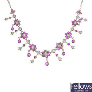 A ruby and diamond floral necklace.