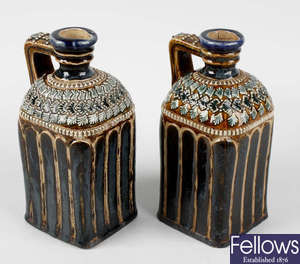 A pair of late Victorian Doulton Lambeth stoneware decanter bottles