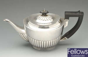 A Victorian silver teapot & a pair of plated pincer tongs.