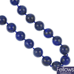 A lapis lazuli necklace and ear pendants.
