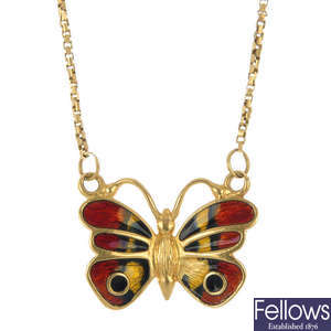 An enamel butterfly pendant.