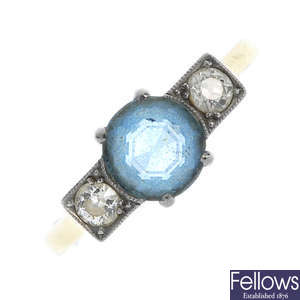 A mid 20th century 18ct gold and platinum aquamarine and diamond three-stone ring.