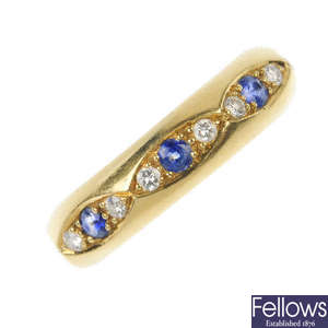 MOUAWAD - an 18ct gold sapphire and diamond ring.