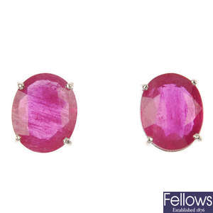 A pair of 18ct gold ruby single-stone earrings.